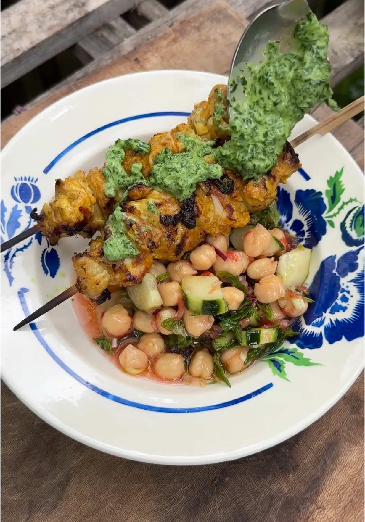 TikTok post by @julius.roberts for John Lewis. Caption reads: Yoghurt marinated chicken kebabs cooked over....