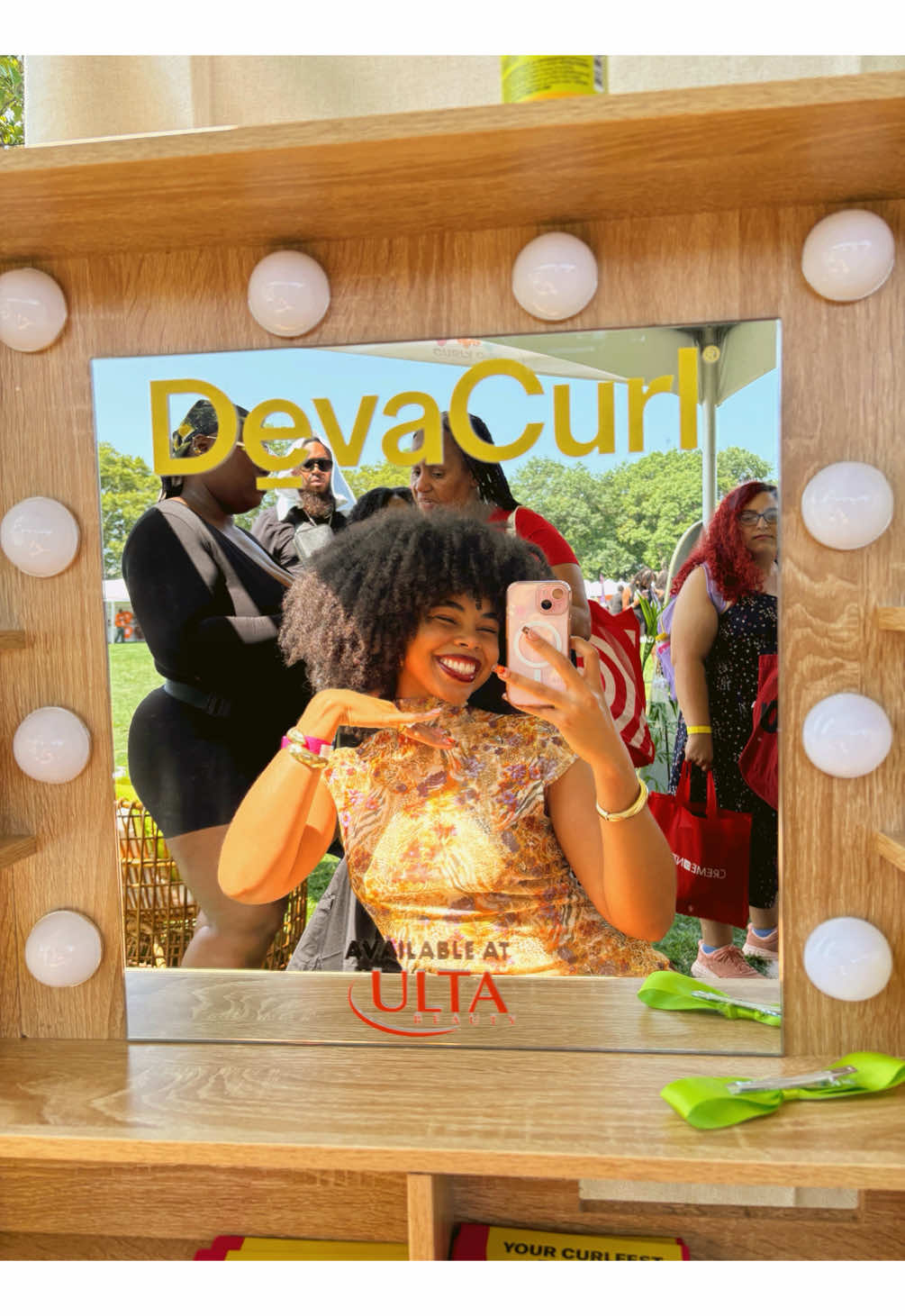 TikTok post by @sheree_denae for DevaCurl. Caption reads: Curly Girl APPROVED🌟➰ @DevaCurl booth was at the....