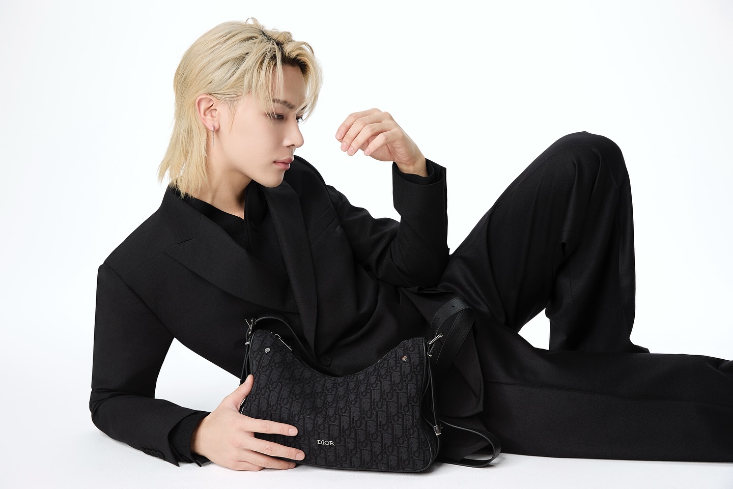 Instagram post by @andteam_official for Dior. Caption reads: Meet the #Dior Slider Hobo Bag @dior
#andTEAM #K....