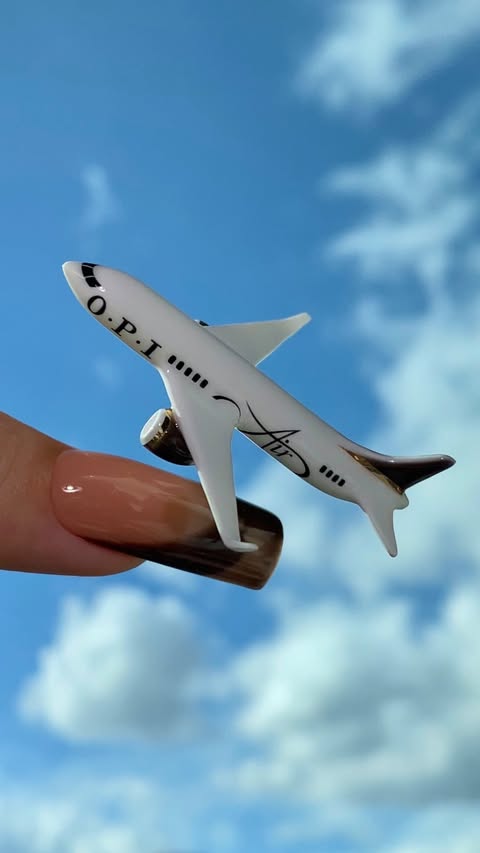 Instagram post by @anouskaanastasia for OPI. Caption reads: @opi air…..but made it mini! ✈️ using shades My....