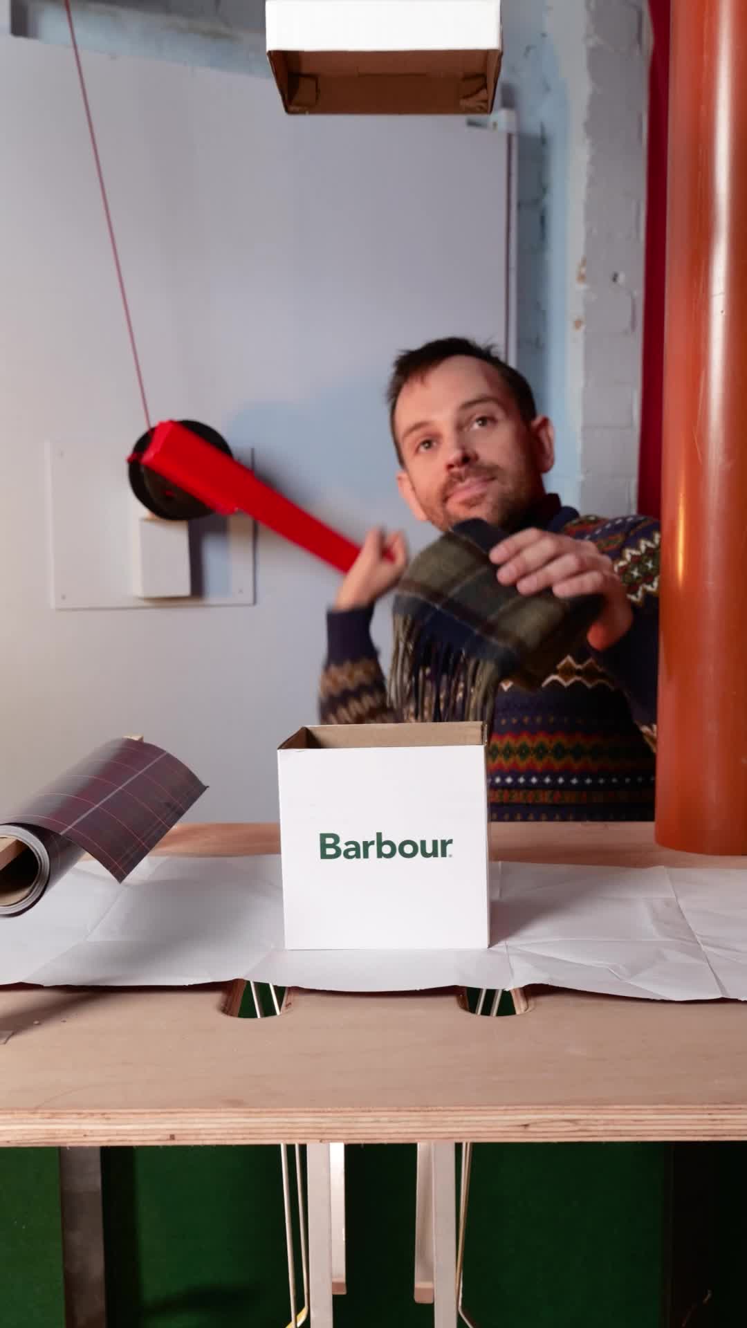 TikTok post by @josephmachines for Barbour. Caption reads: Gifting a @Barbour scarf just got a Gift-O-Matic....