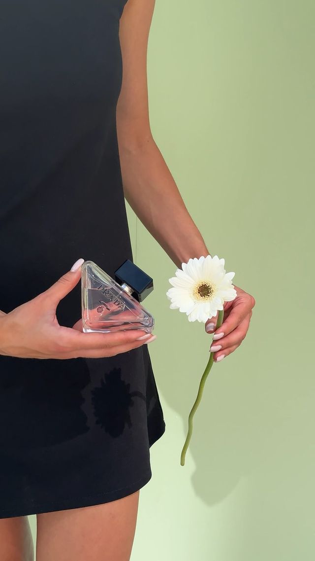 Instagram post by an influencer for Prada Beauty. Caption reads: [...] Virtual Flower by @pradabeauty. Explore the....