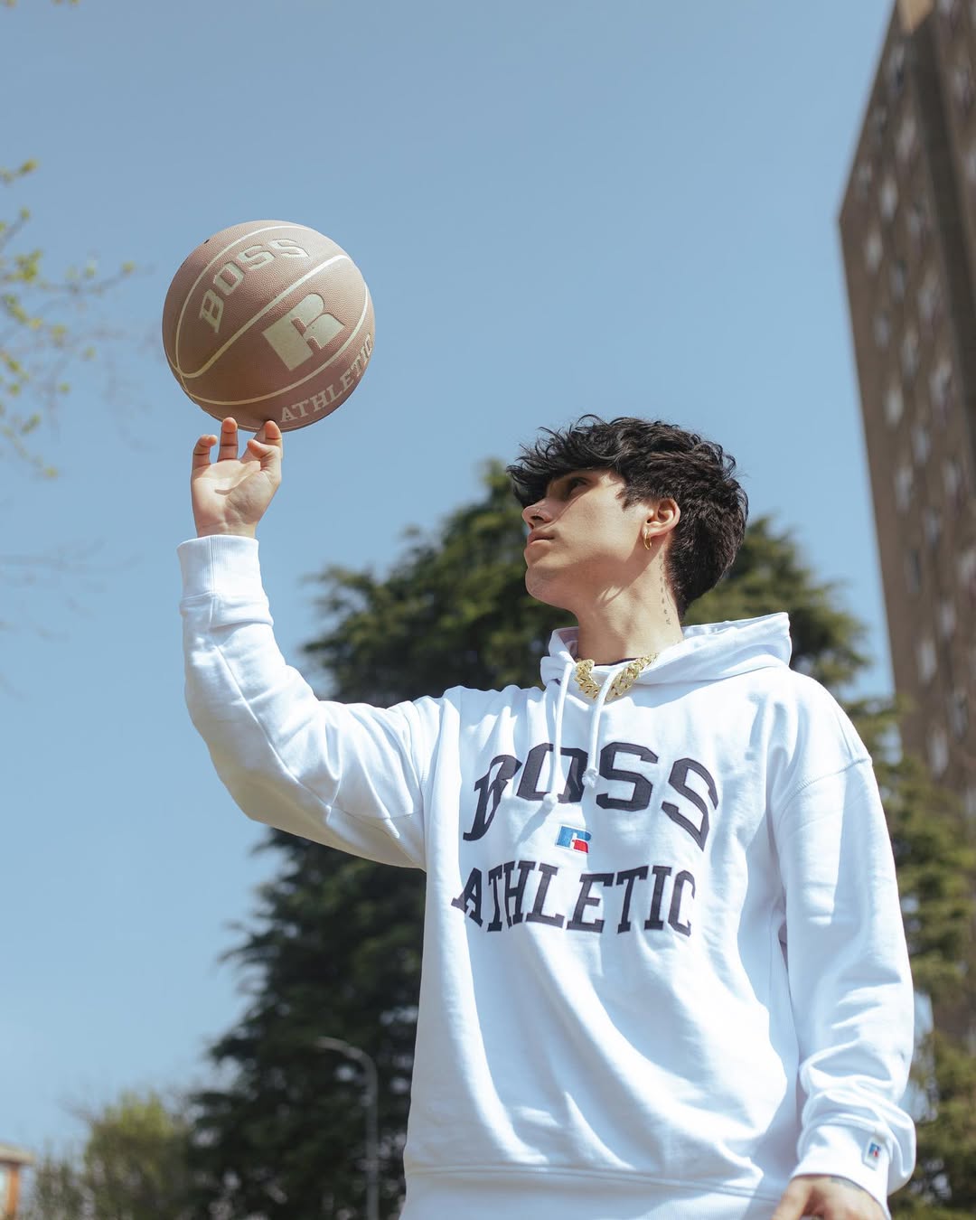 Instagram post by @gianmarco_rottaro for Russell Athletic. Caption reads: Always challenge yourself 🏀 
@boss....