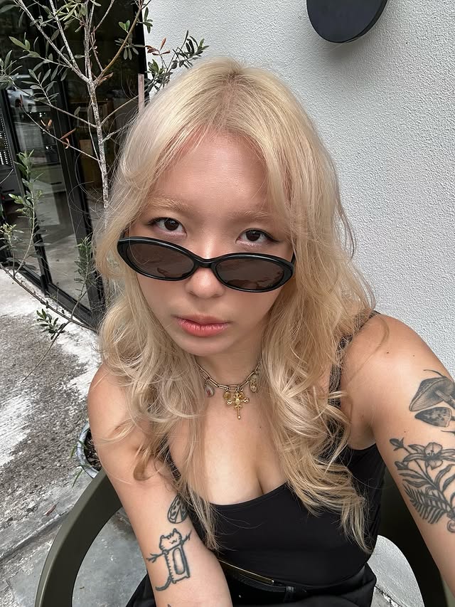 Instagram post by @jasmineeleong for Oscar Wylee Eyewear. Caption reads: not a real blonde until the mysterious black....