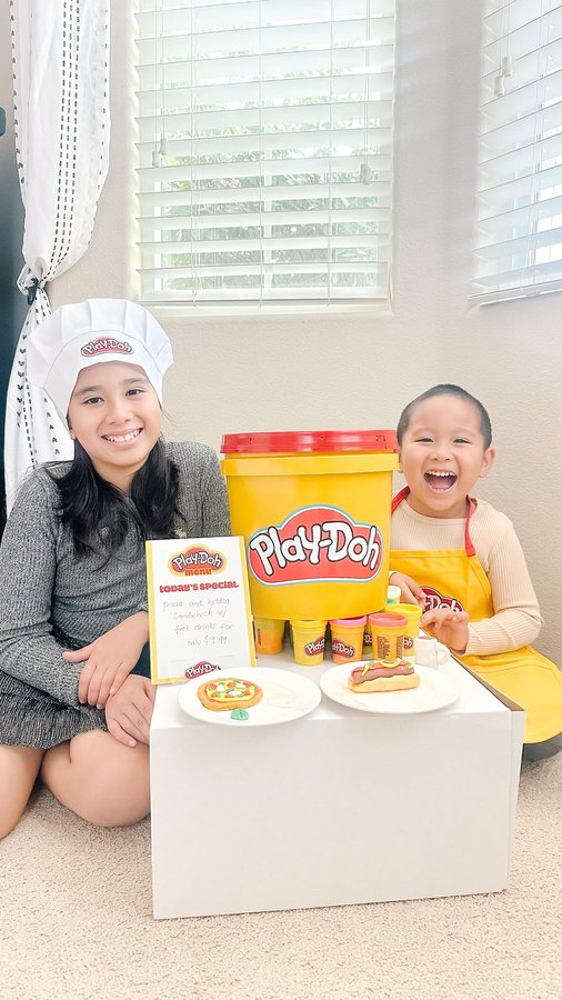 Instagram post by @_growinglittlehumans_ for Play-Doh. Caption reads: [...] creating holiday memories together, one....