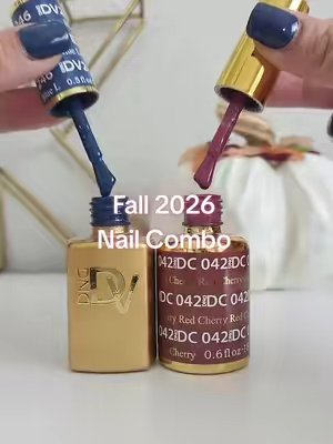 TikTok post by @mrs.kimberly.nicole for DND Gel. Caption reads: [...] Nail Combo - Navy and Burgundy nails @DNDGel....