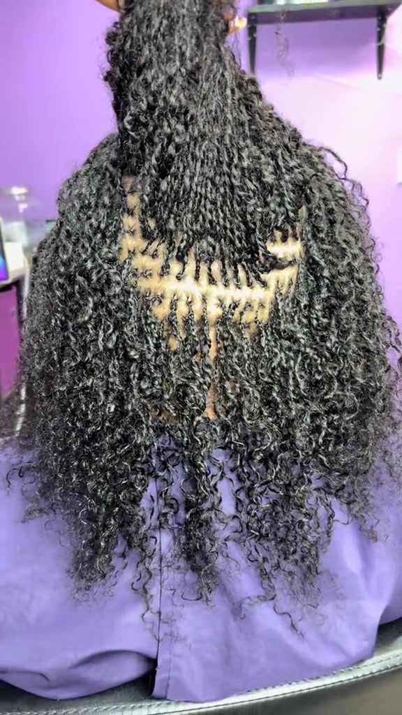 TikTok post by @trellsnaturalhair for Daixidreadology. Caption reads: Microlocs with extensions from @Daixi Dreadology....