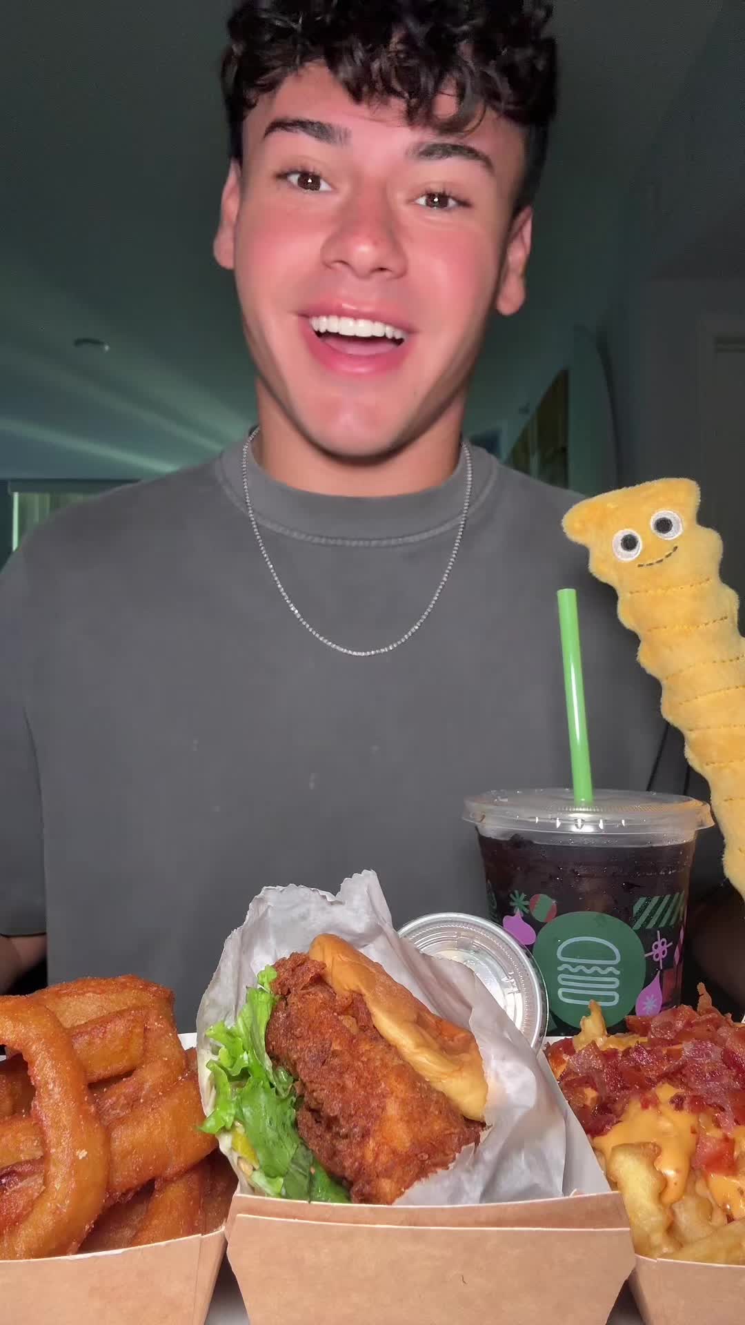 TikTok post by @dylan.mcarthur for Shake Shack. Caption reads: Use Code SHACKCHEER in stores, online, or on the....