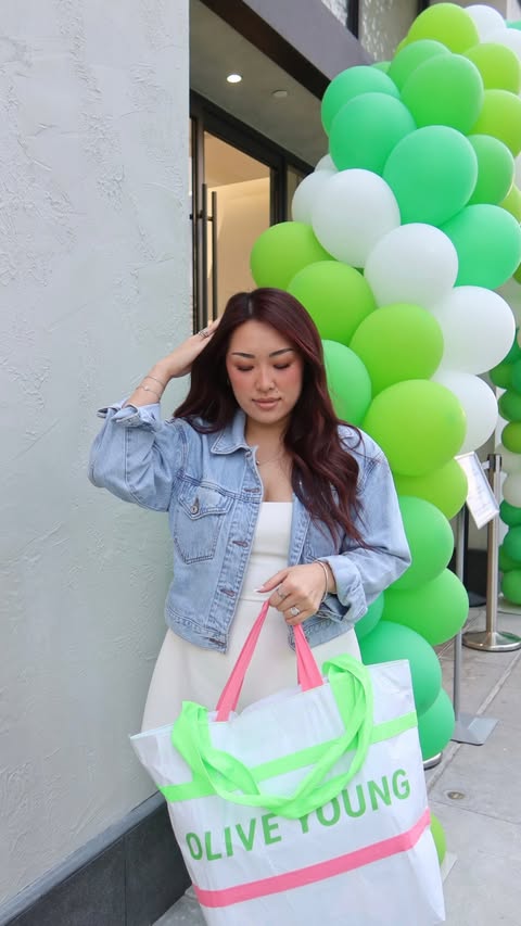 Instagram post by @greeneggsandglamm for Olive Young. Caption reads: @oliveyoung_us flagship is NOW OPEN in LA, let’s....