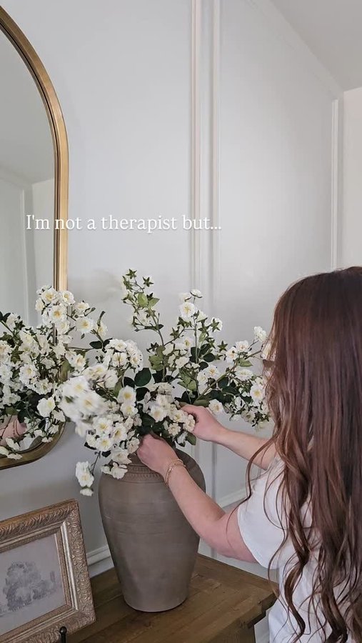 Instagram post by @andriagarciadesigns for Afloral. Caption reads: Not these florals over here curing all my problems....