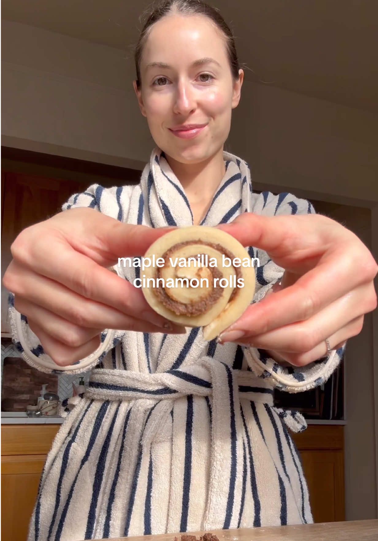 TikTok post by @glowwithella for Brooklinen. Caption reads: Slow Sunday mornings in my @Brooklinen super-plush....