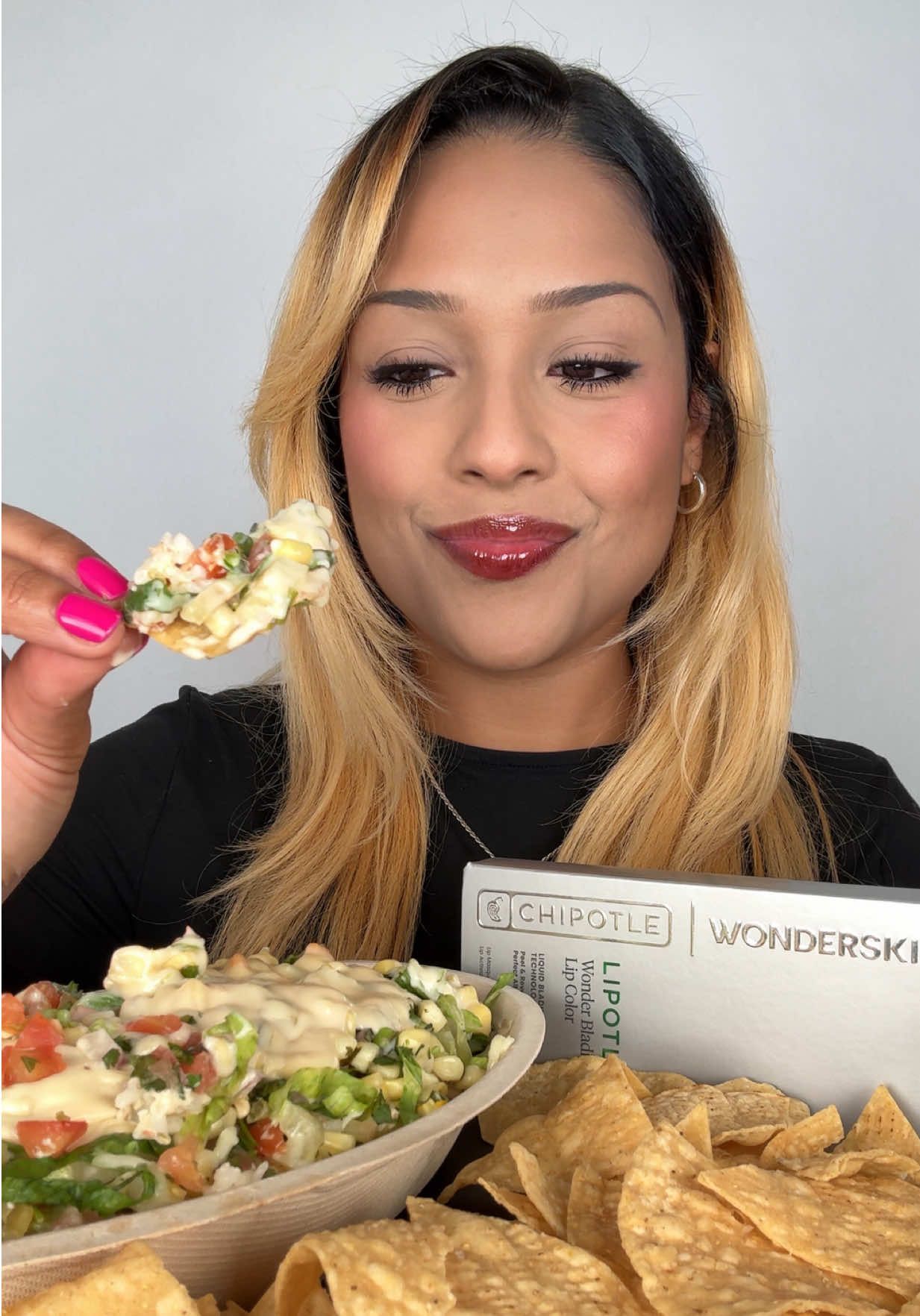 TikTok post by @cookitgirleats for Chipotle. Caption reads: lipotle is back! Putting this lip stain to the....