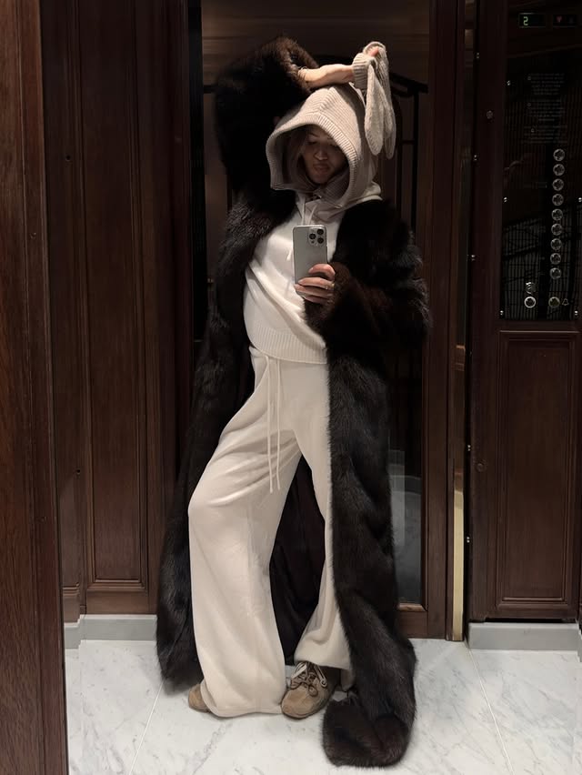 Instagram post by @hannaschonberg for Adanola. Caption reads: [...] | cozy & comfy day in paris wearing @adanola....