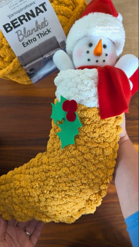 Instagram post by @studio_rosie for Yarnspirations. Caption reads: Cardboard Loom Woven Stocking with @yarnspirations....