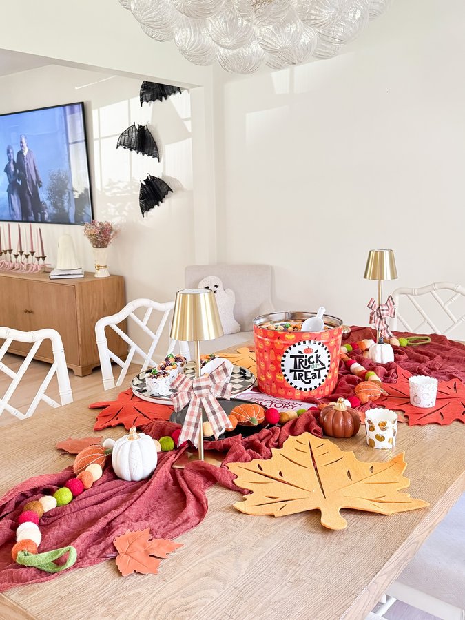 Instagram post by @raisingsharps for The Popcorn Factory. Caption reads: #ad 🎃 Movie night magic 🍿👻 Nothing says spooky....