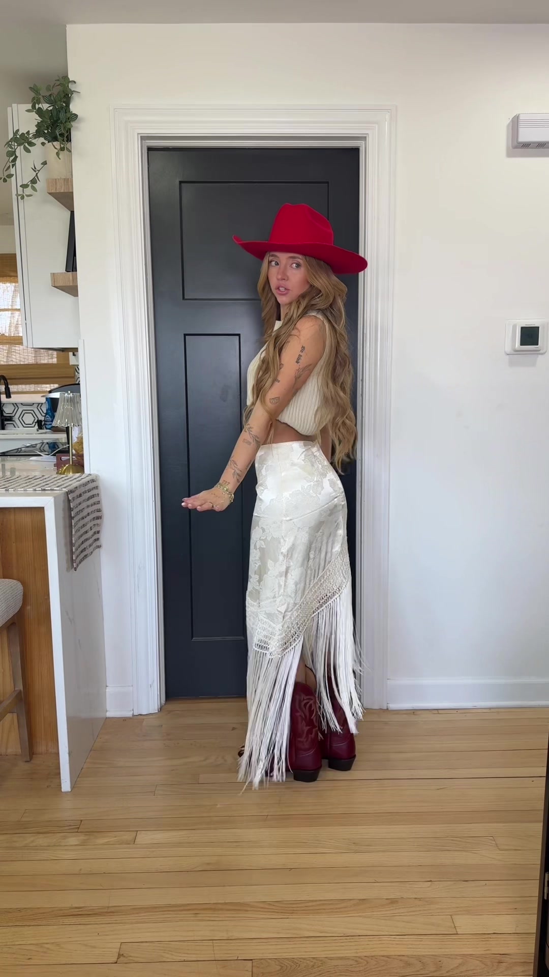 TikTok post by @kaganbrooks for 12th Tribe. Caption reads: The perfect fringe skirt! @12TH TRIBE #fringe....