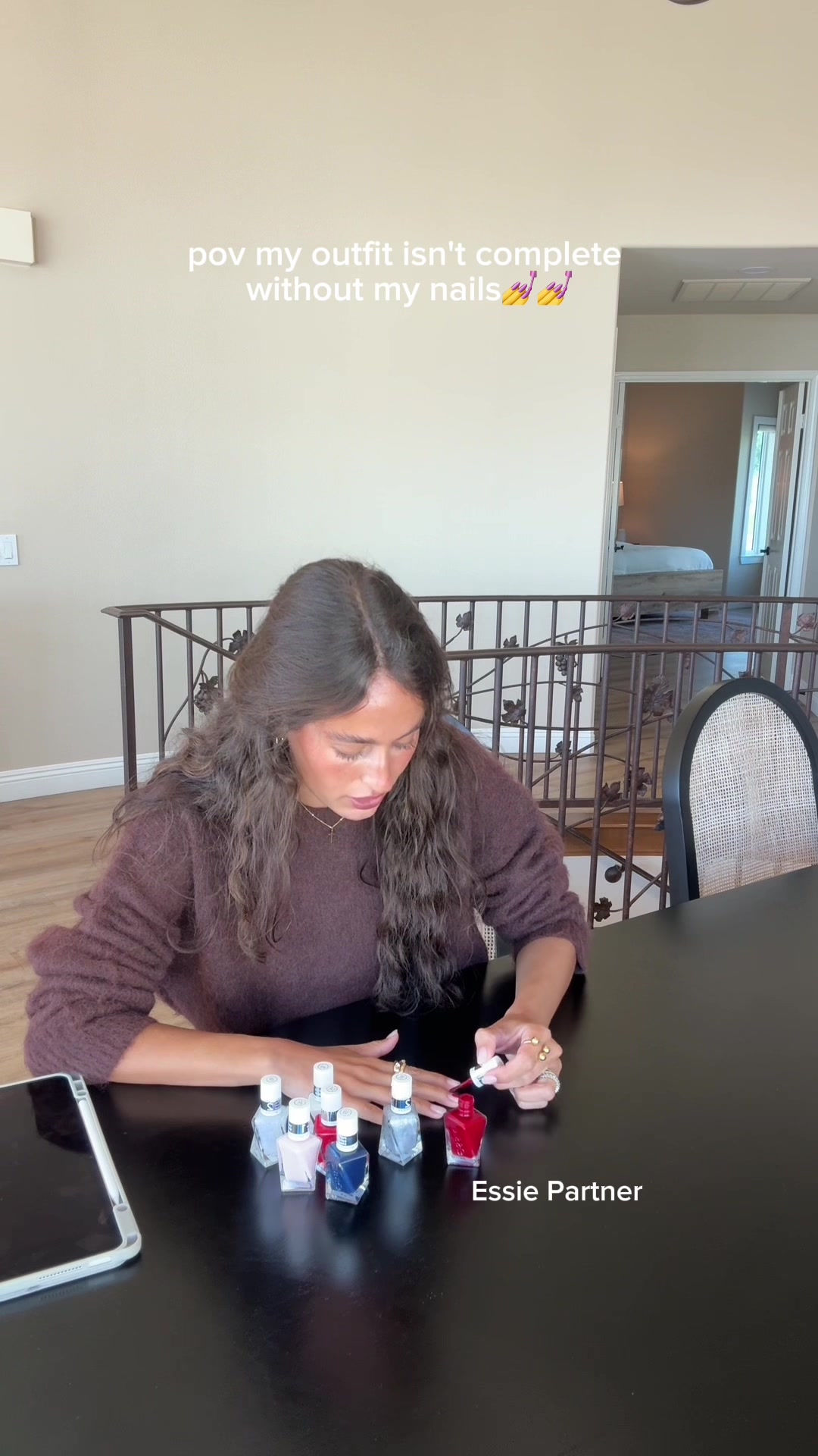 TikTok post by @ellasandramuse for essie. Caption reads: The metallic glaze top coat is my new favorite....