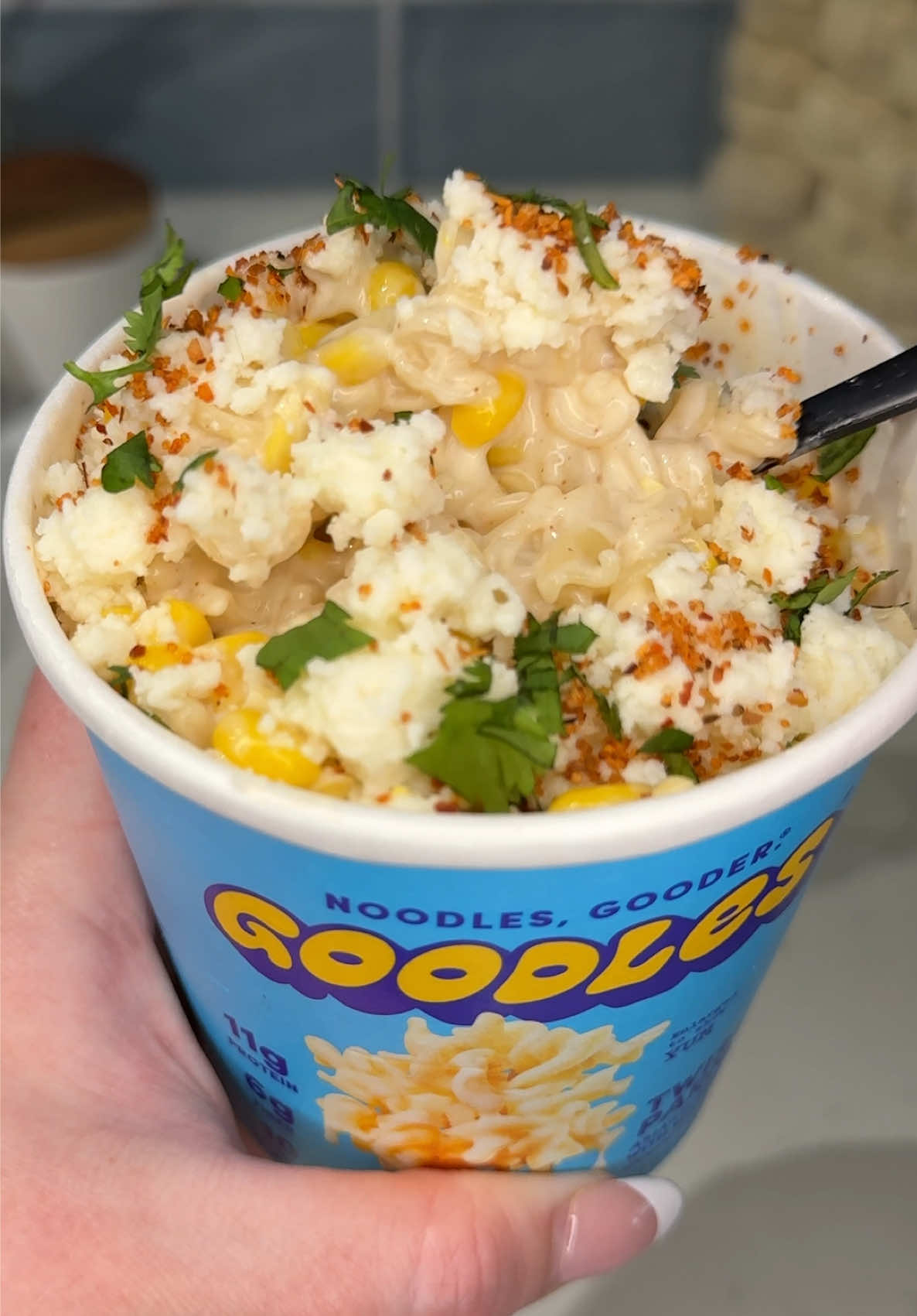 TikTok post by @ashleymarkleeats for Goodles. Caption reads: [...] literally 5 minutes 🔥🌽 Ingredients: 1....