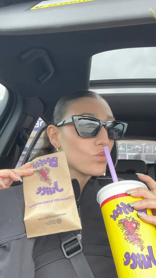 Instagram post by @kiss1023wpg for Booster Juice. Caption reads: Me time + @boosterjuice 🤝🤩💜 This is your chance....