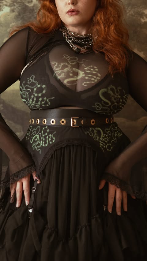 Instagram post by @missdeadlyred for Snag. Caption reads: [...] Shrug- @blackmilkclothing Skirt- @snagtights....