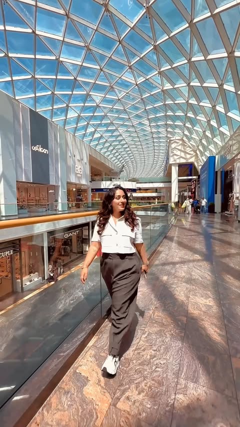 Instagram post by @naomi_dsouza for Emirates. Caption reads: You went out for just coffee and ended up earning....