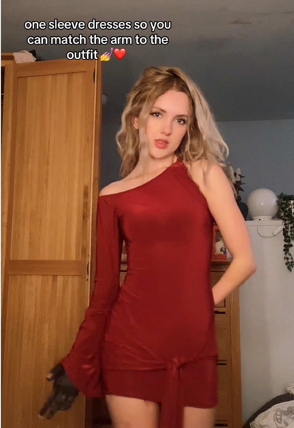TikTok post by @tillylockey for Rebellious Fashion. Caption reads: this dress is so gorgeous HELLO?! #reddress....