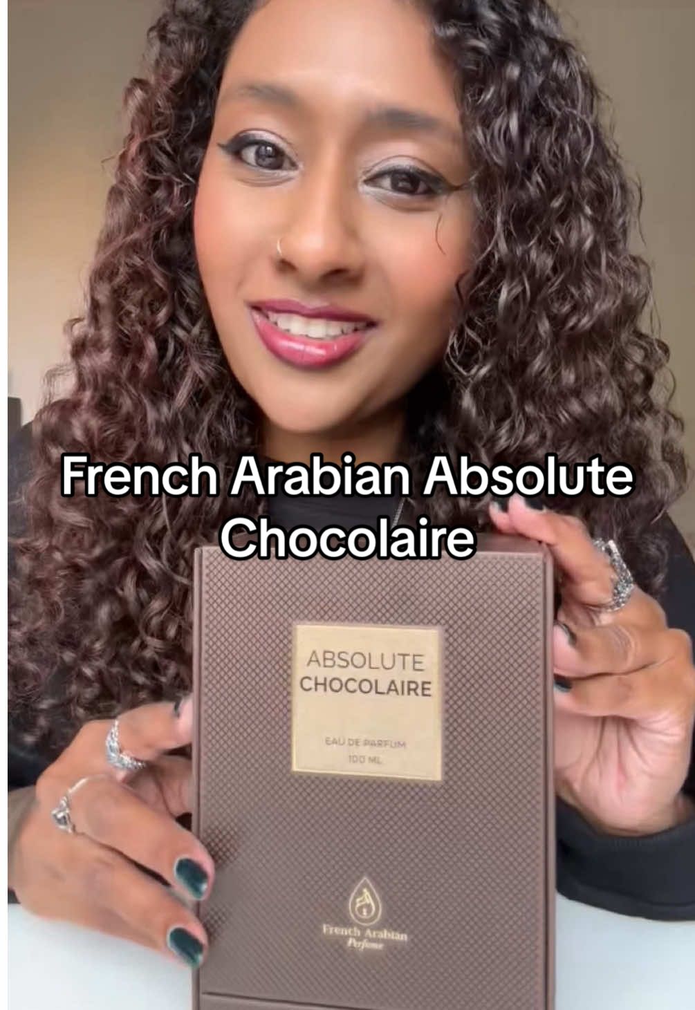 TikTok post by @hematalksperfume for French Arabian Perfumes. Caption reads: @French Arabian Parfum Absolute Chocolaire 🍫😍....