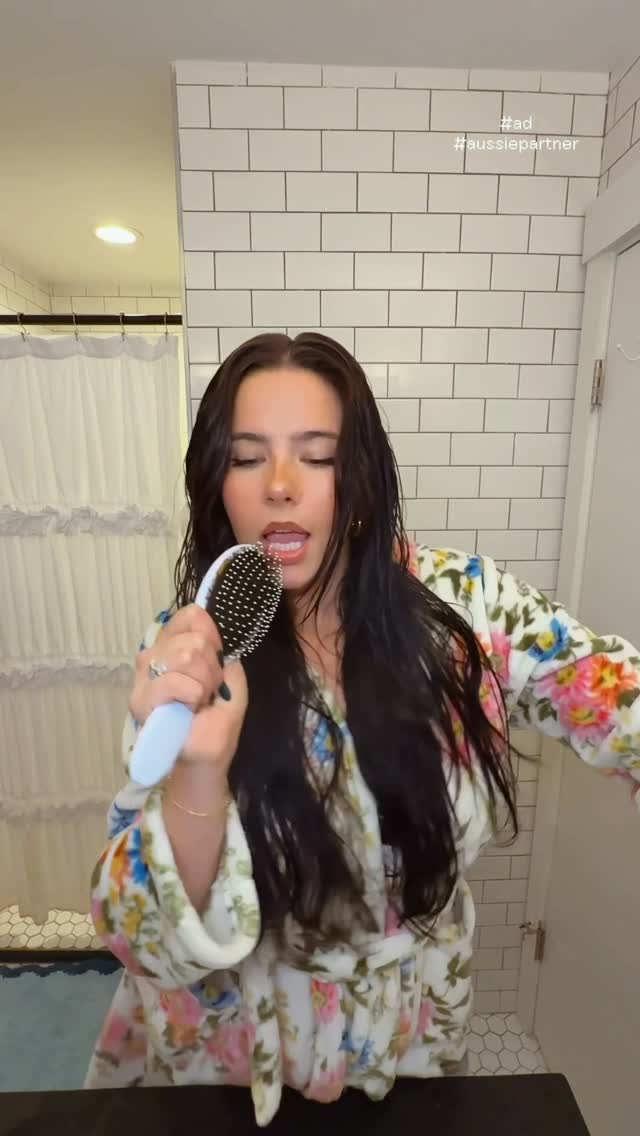 Instagram post by @emmaatopp for Aussie Hair. Caption reads: [...] #ad i triple dog dare you to wonder....