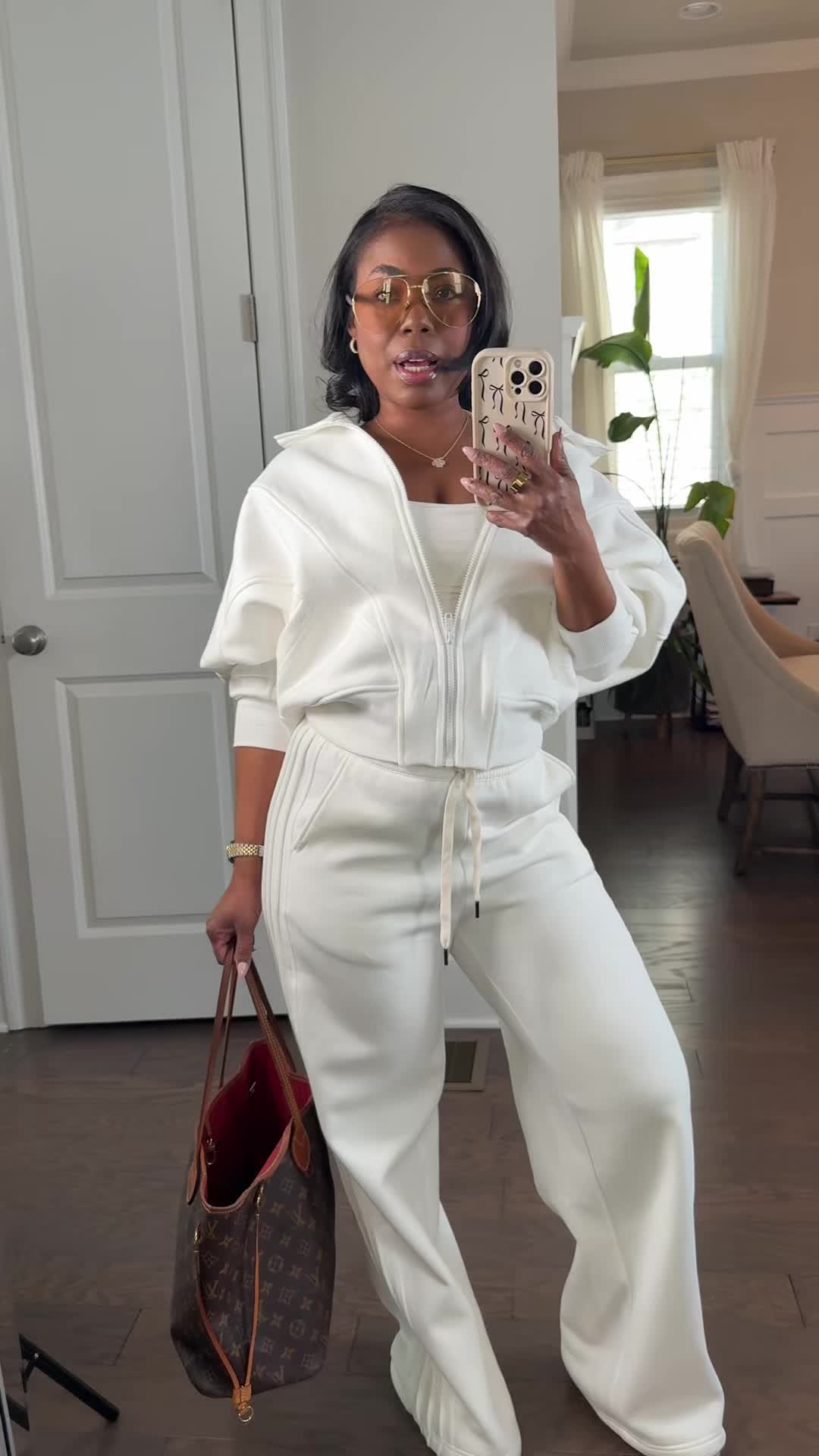 TikTok post by @keyajames for Glowmode. Caption reads: [...] batwing sleeves, and soft warmth @Glowmode....