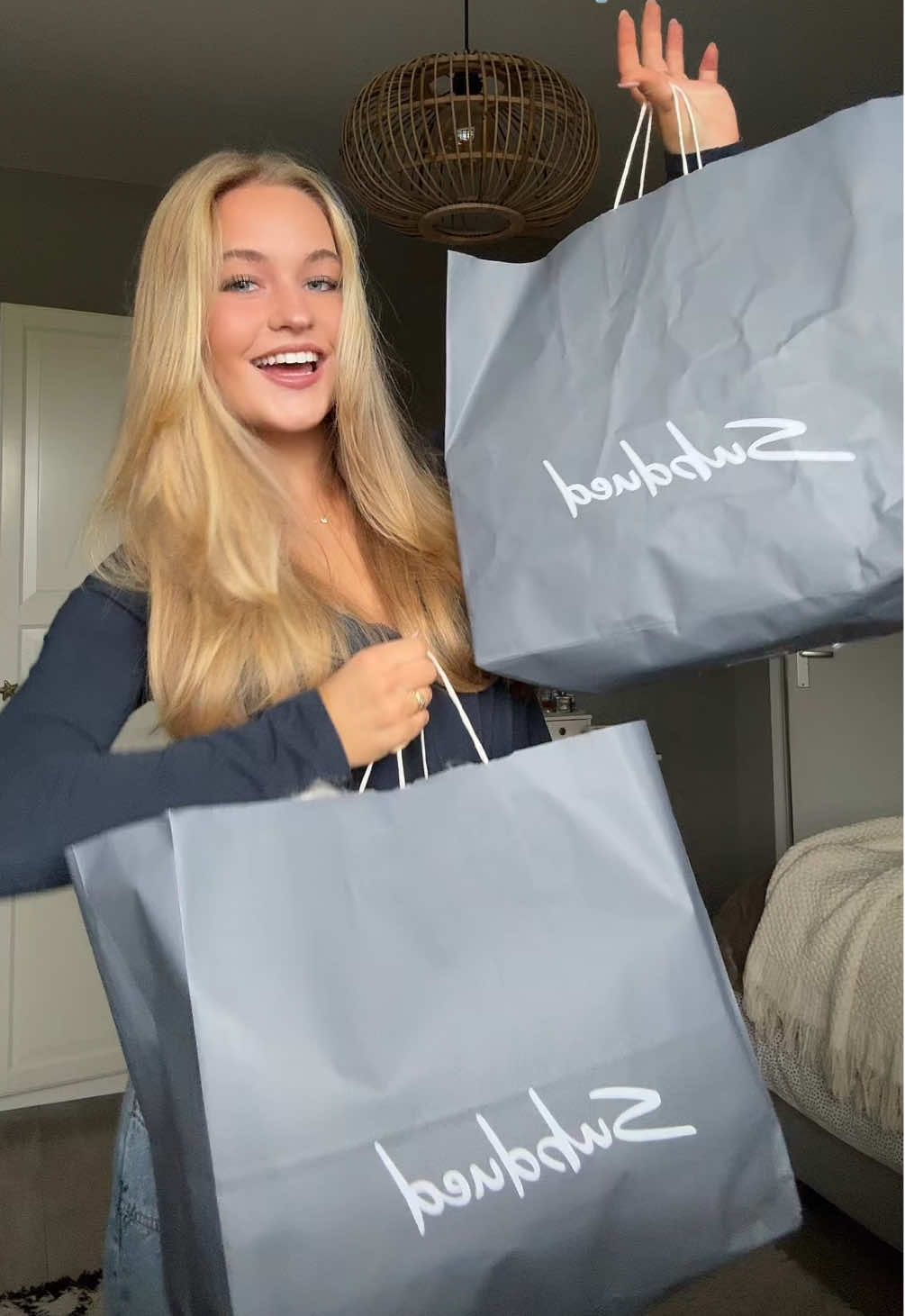 TikTok post by @ivylangenbergg for Subdued. Caption reads: @Subdued fall haul + try on🪽🍂 #collab #subdued....