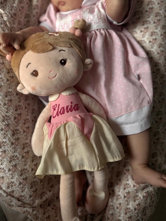 Instagram post by @alessioelariaandmama for Leyadoll. Caption reads: just a girl and her dolly 💕 AD | GIFTED #dolly....