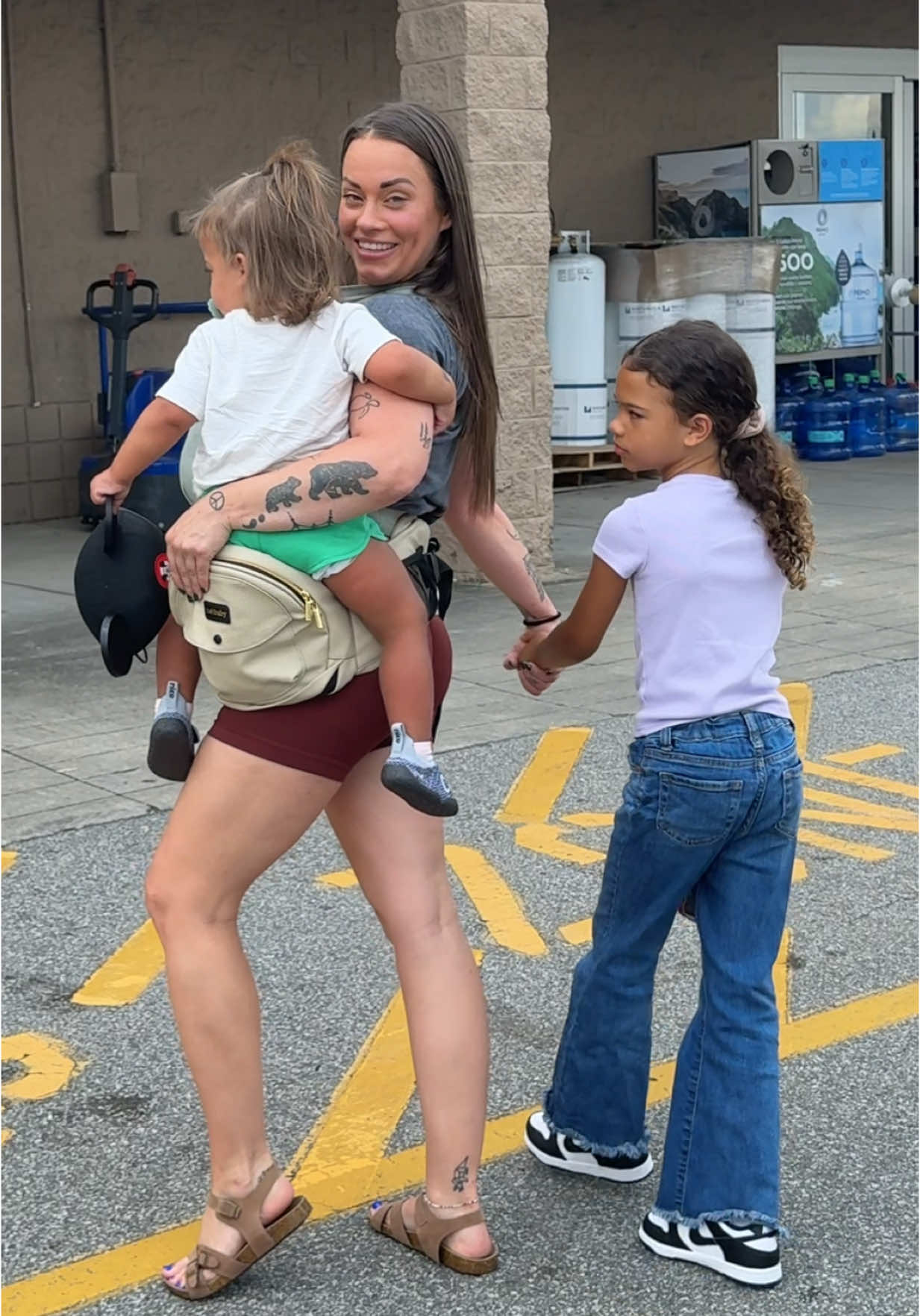 TikTok post by @growingwithkelsey for Tushbaby. Caption reads: [...] #motherhood #blendedwiththewoods @tushbaby .