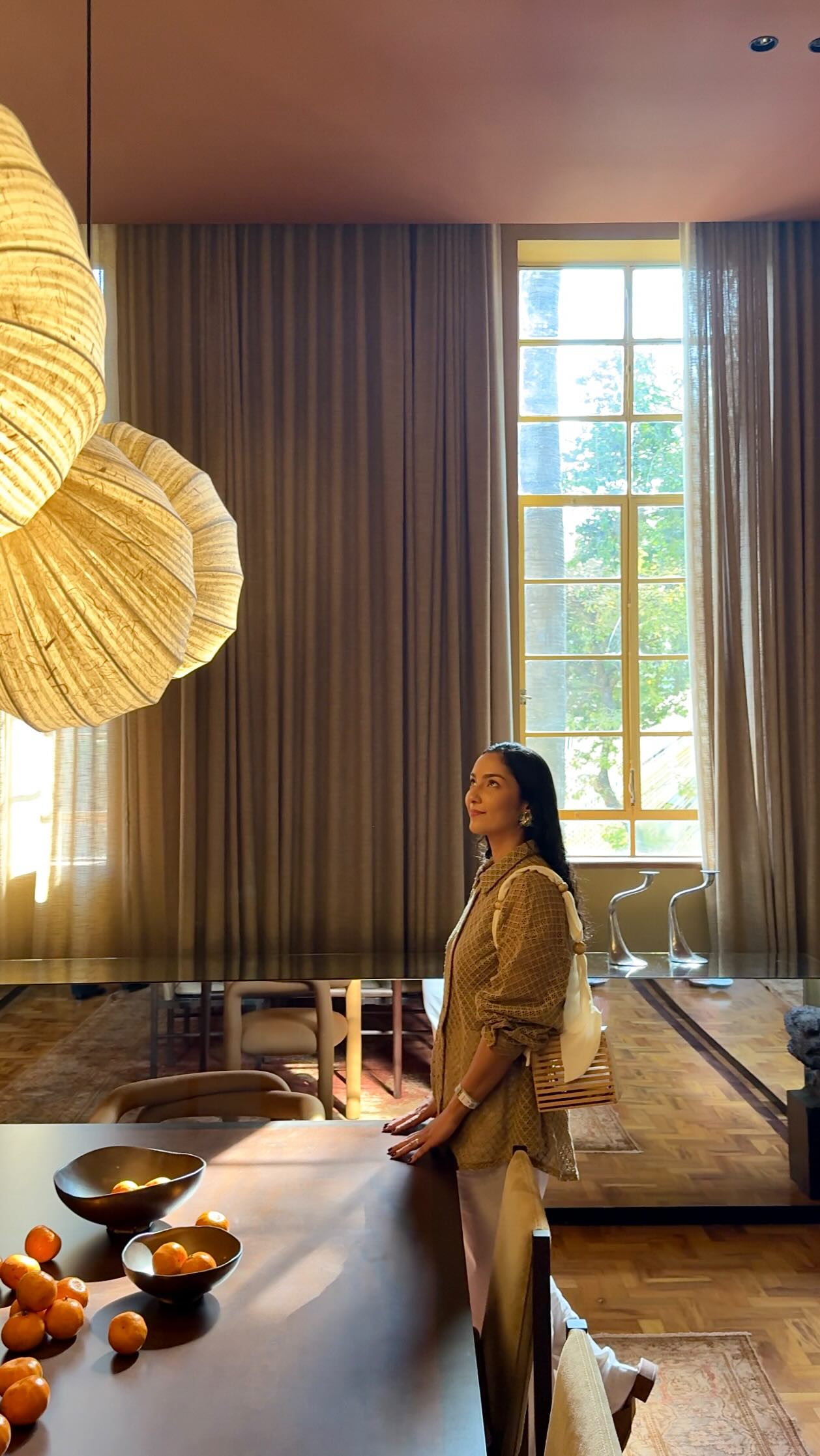 Instagram post by @natmartinsilva for QuintoAndar. Caption reads: A melhor forma de se sentir em casa, é deixá-la....