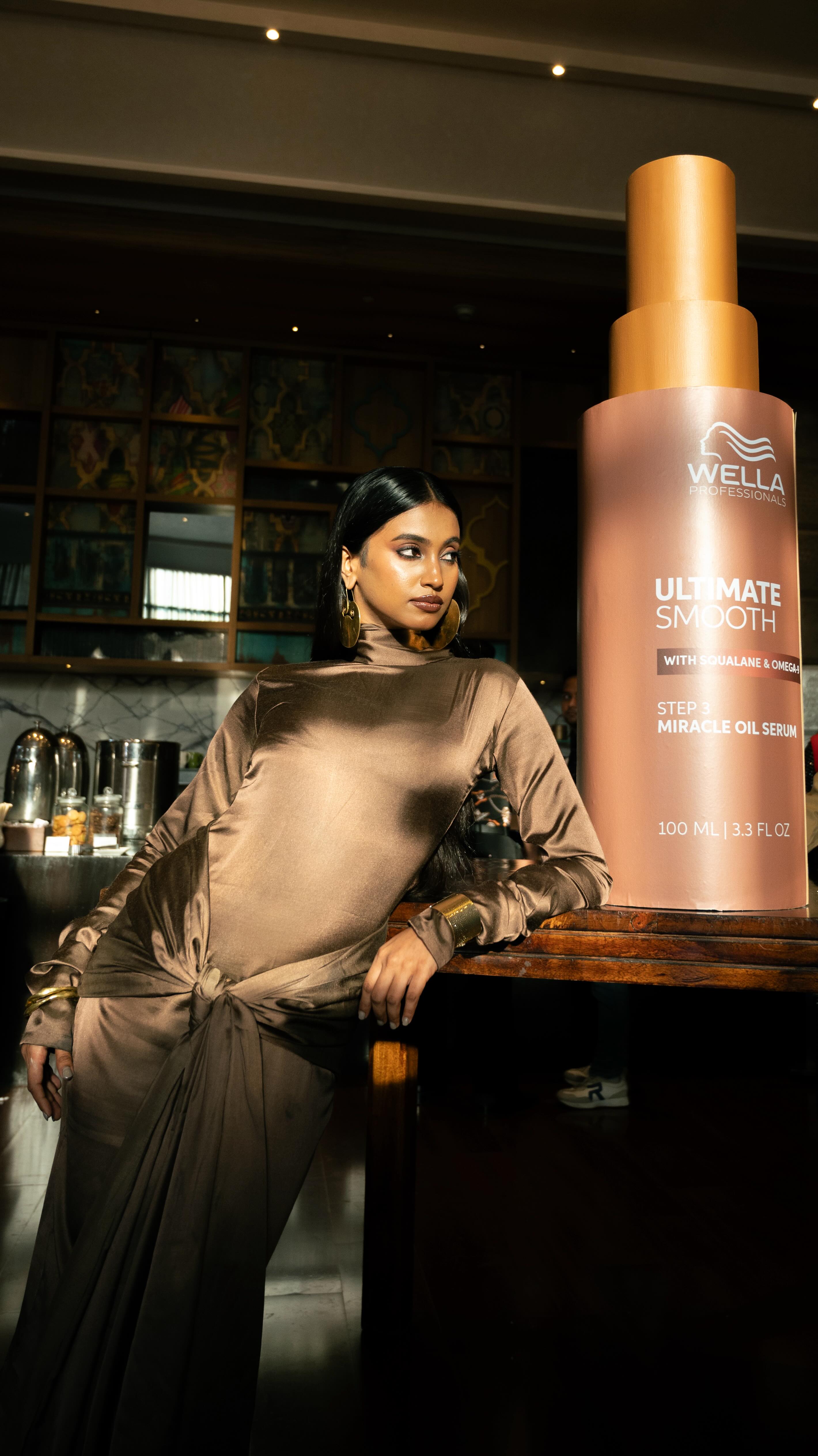 Instagram post by @srijitaghosh4u for Wella. Caption reads: Miracle in a bottle? Confirmed. Frizz tamed in 30....