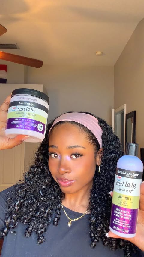 Instagram post by @eliyajoelle for Aunt Jackie's Curls & Coils. Caption reads: Is @auntjackiescurlsandcoils newest drop a hit or....
