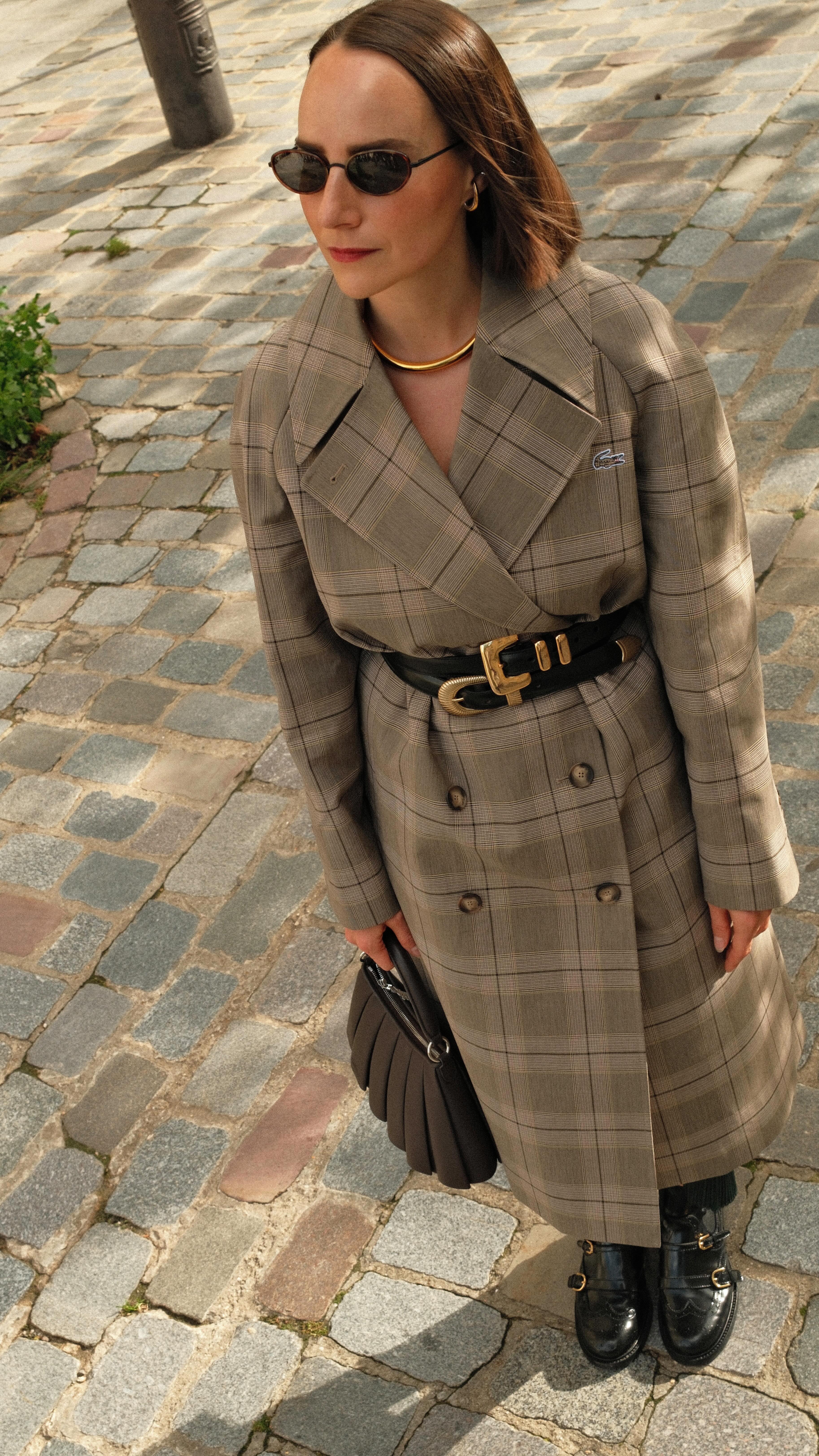 Instagram post by @hawleydunbar for Lacoste. Caption reads: When the trench makes the look.