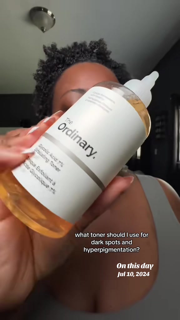 TikTok post by @lashaunbiggz for FarmacyBeauty. Caption reads: #onthisday #glycolicacid #toner #darkspots....