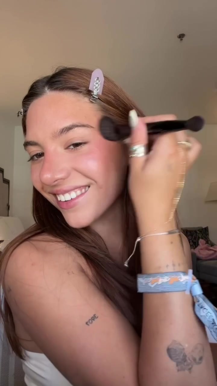 TikTok post by @mackenzieziegler for Saie hello. Caption reads: festival glow with @Saie 💗#saiebeauty....
