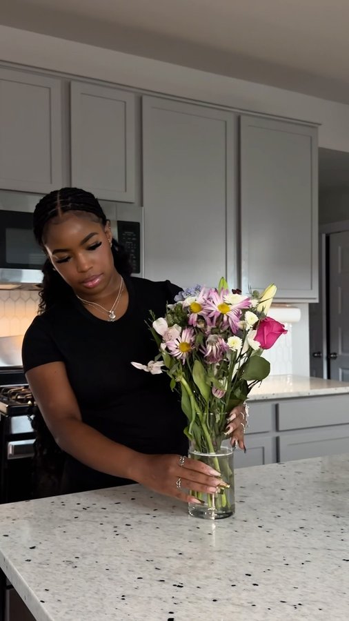 Instagram post by @kelsiekeaira for Personalization Mall. Caption reads: was gifted a customized vase so 2025’s flowers....