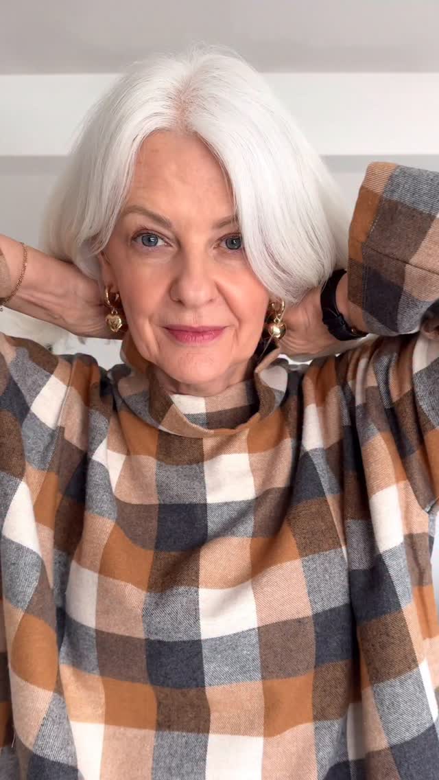 Instagram post by @embracingfifty for Valentino Beauty. Caption reads: 🍂Autumn  uniform, checks & leather 🍁

*Shirt....