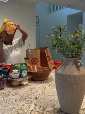 TikTok post by @diana_sayon for Trader Joe's. Caption reads: [...] Nutrition @Boursin Cheese @target @Trader....