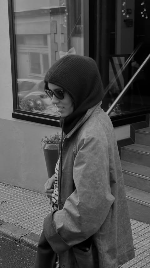 Instagram post by @christinacaradona for Away. Caption reads: Holiday Cam 📹 home for the holidays

Suitcase:....