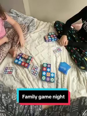 TikTok post by @life.with.katy for The Uzzle. Caption reads: Playing @The Uzzle with my kids tonight 🧩❤️ Such....