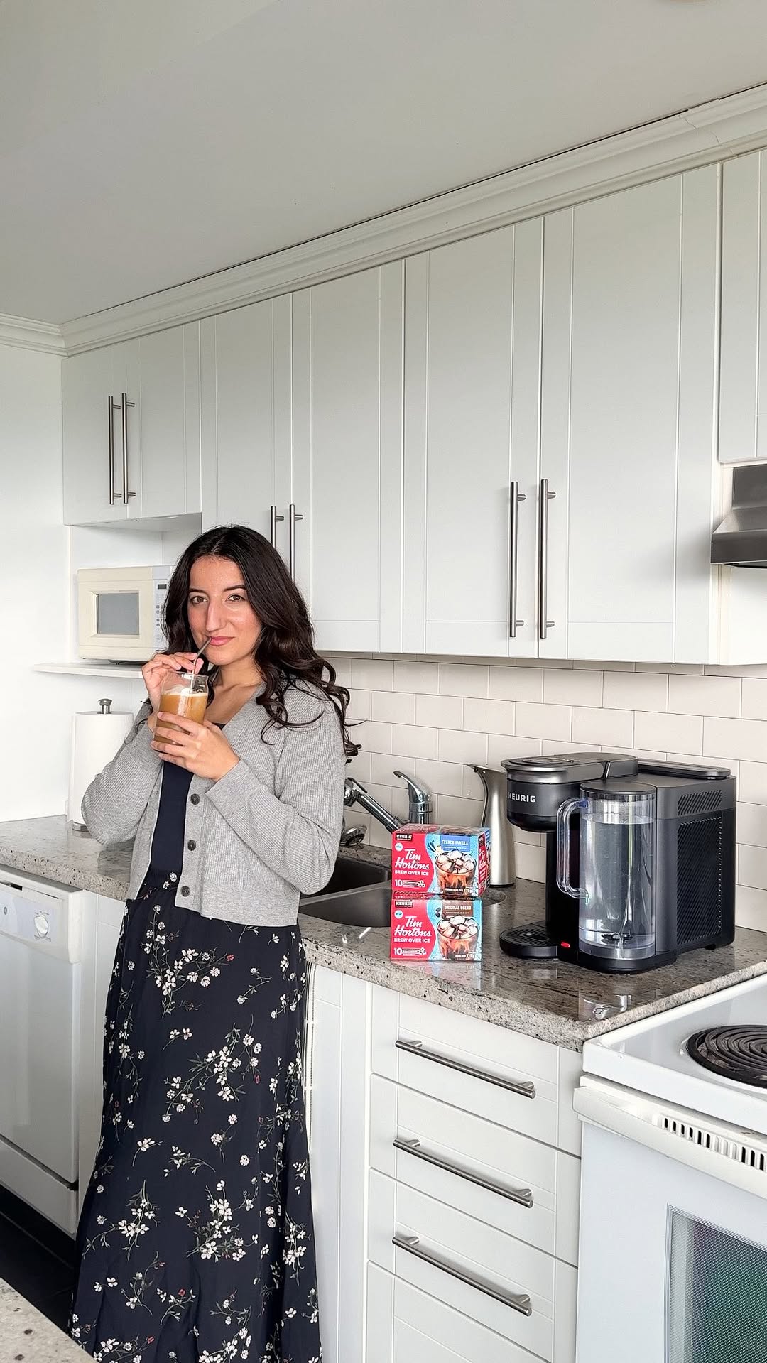 Instagram post by @caitlinmariedasilva for Tim Hortons. Caption reads: Chilling is a lot easier when iced coffee is....