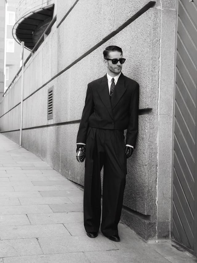 Instagram post by @pelayodiaz for Alexander McQueen. Caption reads: [...] Styled with tie and clutch by Alexander....