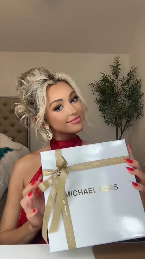 Instagram post by @taliacwood for Michael Kors. Caption reads: my new fav date night scent 🤩 

#ad #MichaelKors....