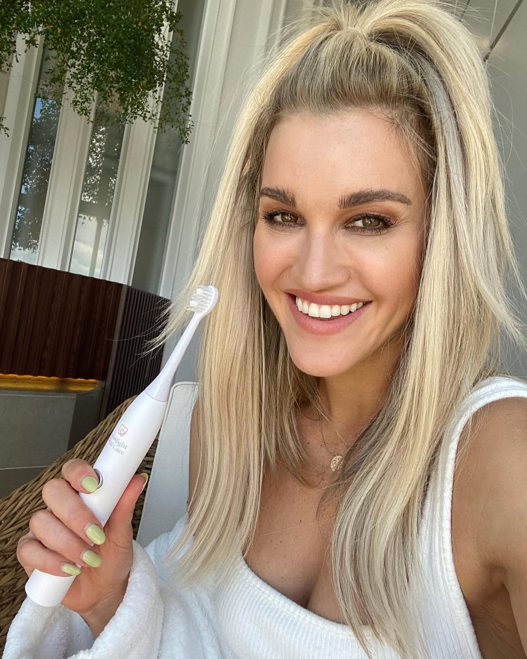 Instagram post by @iamashleyroberts for Spotlight Oral Care. Caption reads: My mom had issues with her gums when I was young....