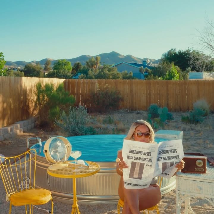 Instagram post by @kirahominique for Sheamoisture. Caption reads: “Breaking News “.. the GWORLS are staying oiled up....