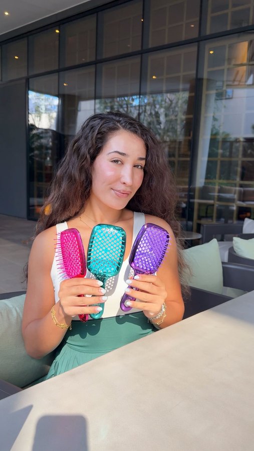 Instagram post by @laladoghmi for FHI Heat. Caption reads: From frizz to flawless in seconds — that’s the....