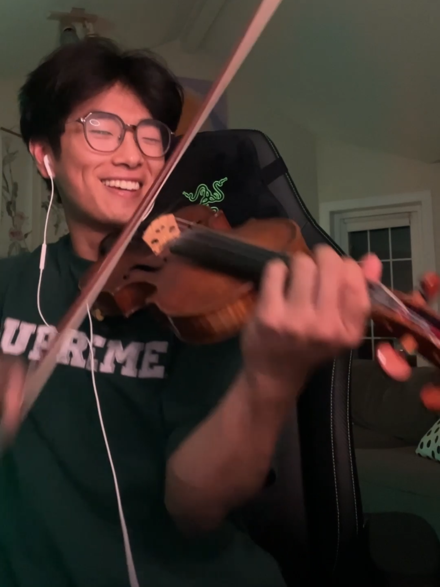 TikTok post by @kurttheviolinist for Razer. Caption reads: [...] to you - @olivianewtonjohn,....